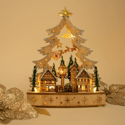 Decorative Christmas tree with houses and lights on a beige background