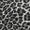 Close-up of a black and white leopard or cheetah animal print fabric pattern.