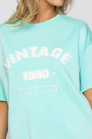 Carraig Donn Aqua Viscose Blend Slogan Top