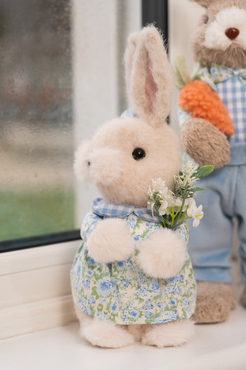 Blue Easter Bunny Girl Holding Flowers
