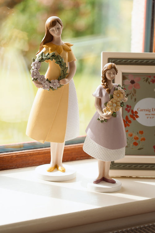 Decorative Girl in Yellow Dress Holding Flower Wreath