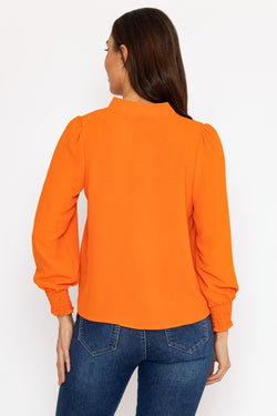 Carraig Donn Long Sleeve Collarless Top in Orange