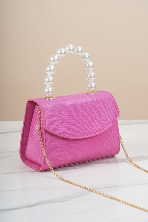 Carraig Donn Pearl Top Handle Clutch Bag in Fuchsia Pink