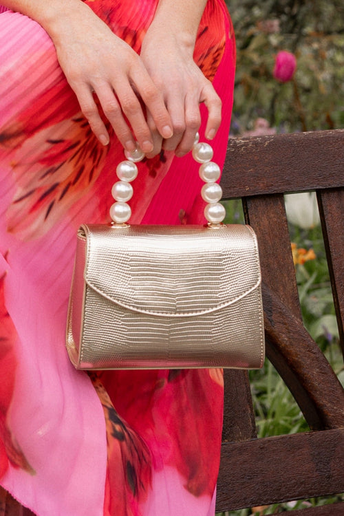 Pearl Top Handle Clutch Bag in Gold