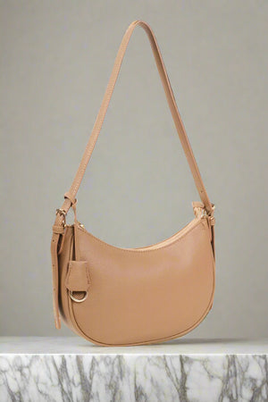 Carraig Donn Tag Crescent Shoulder Bag in Beige