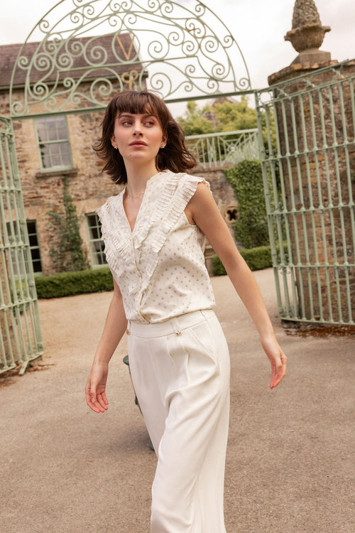 Cream Sleeveless Ruffle Top with Metallic Polka Dots
