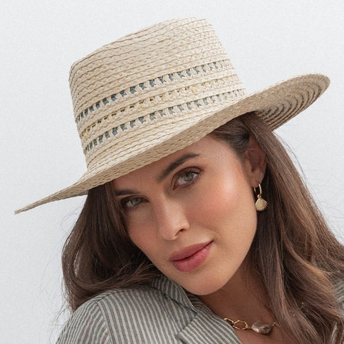Woman wearing a straw hat with a white background